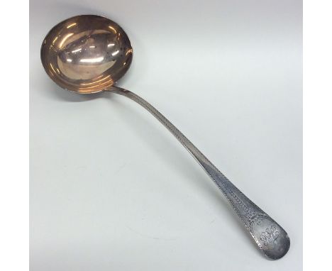 A Georgian silver bright cut soup ladle decorated with flowers and leaves. London. By WT. Approx. 194 grams. Est. £80 - £120.