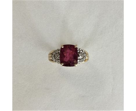 A diamond and ruby cluster ring in claw mount. Approx. 5.3 grams. Est £60 - £80