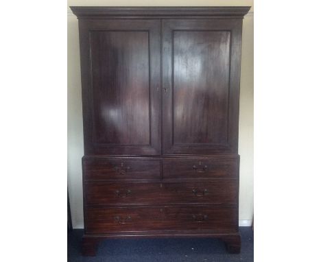 A massive Georgian four drawer linen press on bracket feet. Est. £100 - £150.