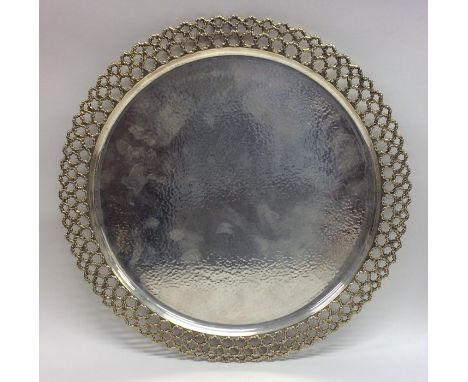 STUART DEVLIN: A large silver and silver gilt tray of textured design. Approx. 30.5 cms in diameter. Approx. 612 grams. Est. 