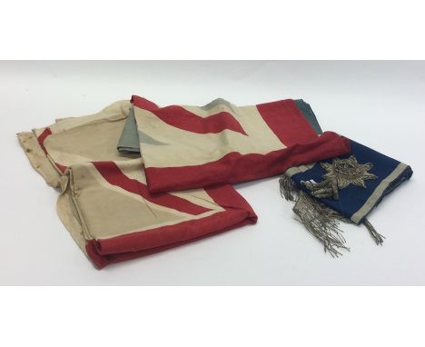 Two old flags together with a blue and white sash. Est. £20 - £30.