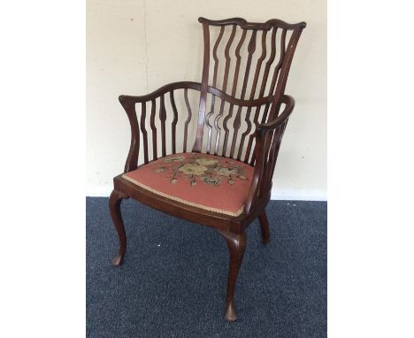 An Edwardian mahogany chair with tapestry seat. Est. £30 - £40.