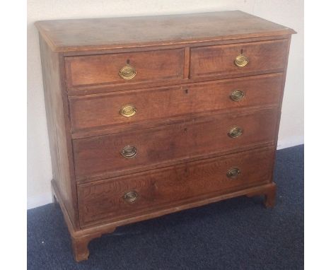 A Georgian oak chest of three long and two short drawers on bracket feet. Est. £30 - £50.