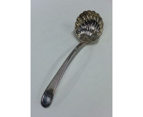 A Georgian bottom marked silver ladle with fluted bowl. London. Approx. 50 grams. Est. £25 - £35.