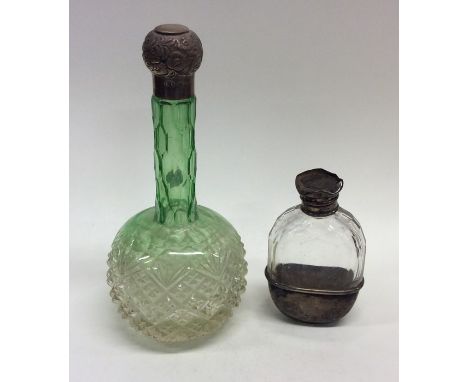 A small silver and glass mounted handbag flask together with a green glass scent bottle. Est. £10 - £20.