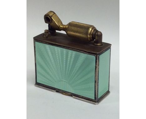 MCMURDO: A novelty silver and green enamel lighter. Approx. 452 grams. Est. £250 - £350.
