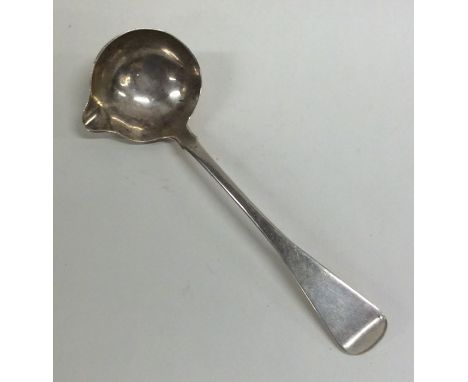 An Irish silver rat tail cream ladle. Approx. 30 grams. Est. £20 - £30.