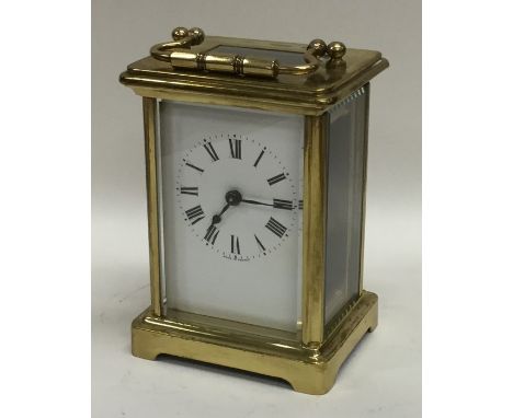 A small brass mounted carriage clock. Est. £25 - £35.