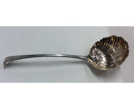 A Georgian aesthetic silver sauce ladle with fluted bowl. Approx. 50 grams. Est. £20 - £30.