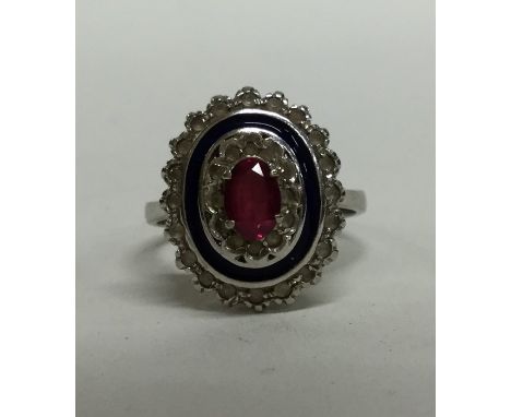 A ruby and enamelled cluster ring in 18 carat gold. Approx. 4.5 grams. Est. £120 - £150