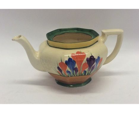 A Clarice Cliff 'Crocus' pattern teapot decorated with flowers. (Missing lid). Est. £30 - £50.