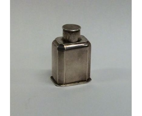An Antique silver miniature tea caddy with cut corners and lift-off cover. Apparently unmarked. Approx. 4 cms high. Est. £200