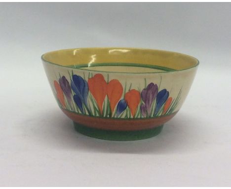 A Clarice Cliff 'Crocus' pattern bowl of typical design. Approx. 16 cms in diameter. Est. £80 - £120.