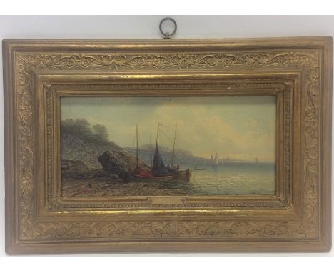 JAMESON: A gilt framed oil on board depicting a seascape with boats on the shore. Signed 'Jameson' to bottom left and 'W Rich