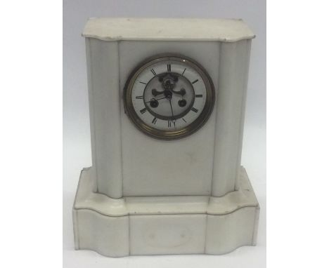 A large white marble mantle clock with striking movement. Est. £25 - £35.
