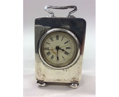 A silver miniature carriage clock with white enamelled dial to ball feet. Chester. By SB&amp;S. Approx. 264 grams. Est. £150 