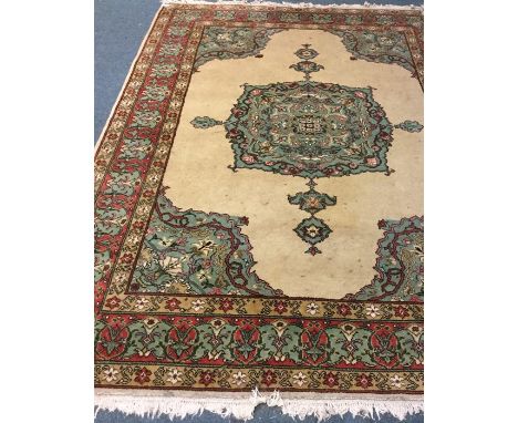 An Antique tapestry Oriental rug in bright colours. Est. £50 - £80.