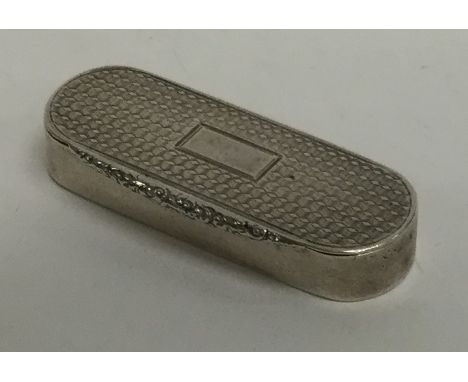 An oval hinged top and engine turned vesta case. Birmingham. By TP. Approx. 18 grams. Est. £120 - £150.