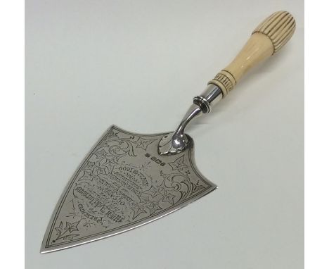 A silver mounted and ivory trowel engraved with flowers and leaves. Sheffield. Approx. 109 grams. Est. £50 - £80.