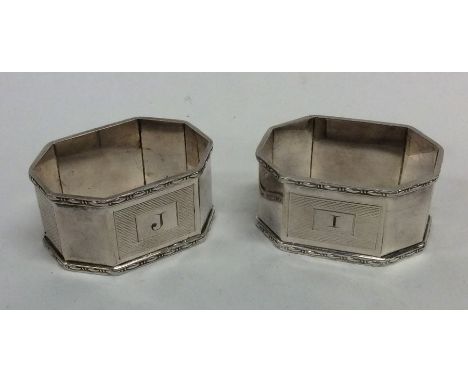 A pair of engine turned silver napkin rings. Birmingham. By Mappin &amp; Webb. Approx. 65 grams. Est. £45 - £55.
