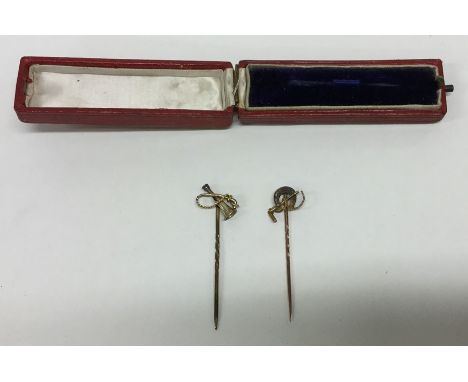 Two gold riding crop stick pins. Approx. 3 grams. Est. £30 - £50