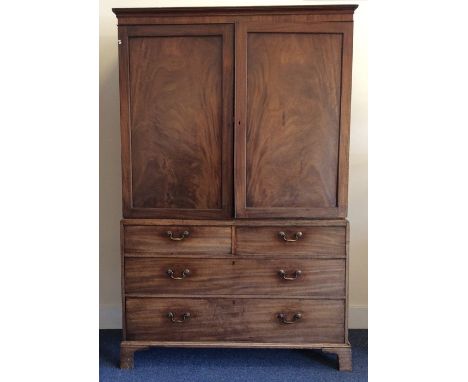 A good Georgian four drawer linen press with fitted interior and brass handles on bracket feet. Est. £100 - £150.