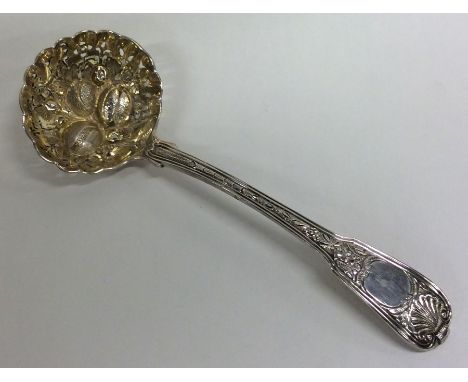 A Georgian silver ladle attractively decorated with flowers and leaves and gilt bowl. London. By RC. Approx. 70 grams. Est. £