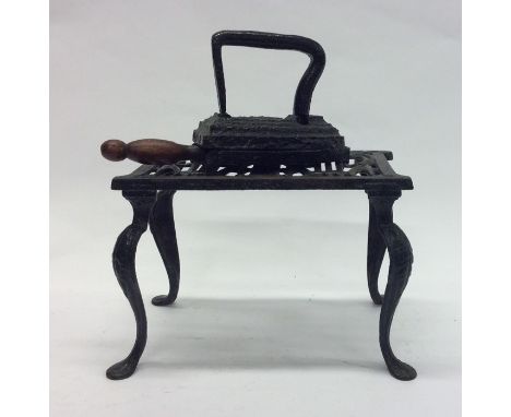 A cast iron flat iron on bracket base. Est. £10 - £20