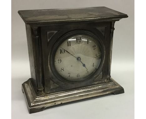A silvered dial mantle clock on bracket feet. By Webster. Est. £60 - £80.