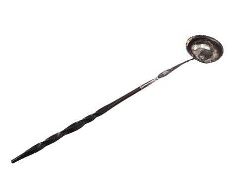 George III silver toddy ladle, the oval bowl set with a coin, with baleen twist handle, L40cm