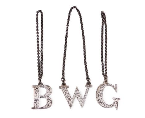 Three Victorian decanter labels, comprising G, B & W, all decorated with engraved scrolling detail, hallmarked George Unite, 