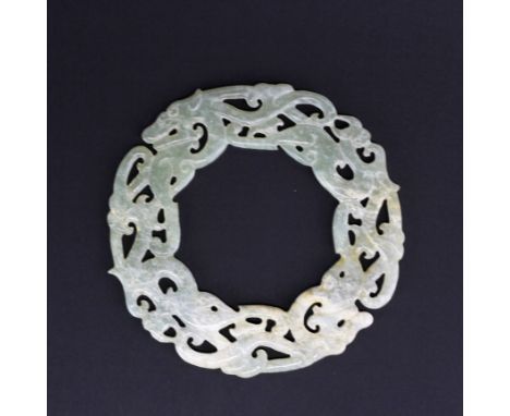 A Chinese archaic form carved jade Pi disc, dia. 10cm.