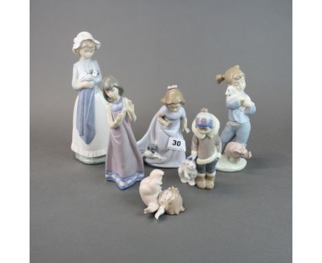 A group of six Nao porcelain figurines, tallest H. 24cm.