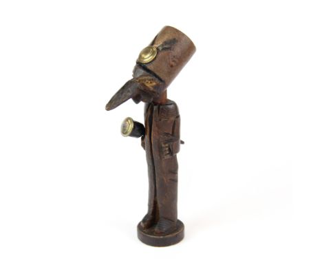An interesting hand carved tobacco pipe with stand and tamper, H. 16.5cm.