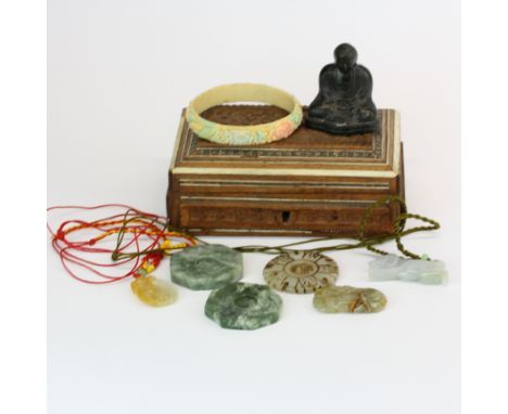 A box of Chinese jade and other items.