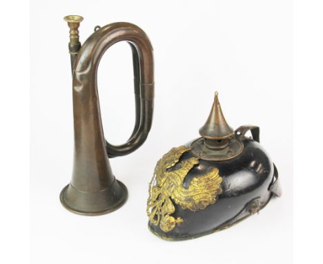 An early German police helmet and bugle.