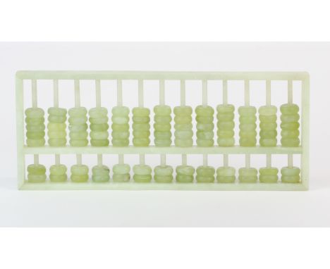 A Chinese jade abacus, 9 x 23 x 1.5cm.