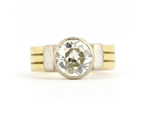 An 18ct yellow and white gold ring set with a large old cut diamond, estimated approx. 2.4ct, (Q). Professionally assessed: I