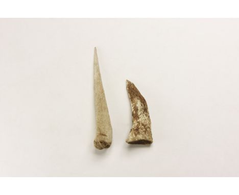 7th-5th millennium BC. A pair of bone tools, one a straight round-section awl and the other curved and triangular in section.