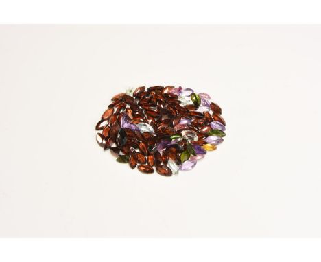 A group of one hundred marquise-cut garnets, citrine, crystal, amethyst and other gem stones.  14.06 grams total, 5-8mm (1/4)
