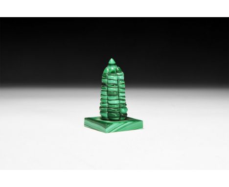 A finely composed statuette of a 'tower' on a rectangular base from banded green malachite.  100 grams, 70mm (2 3/4). From a 