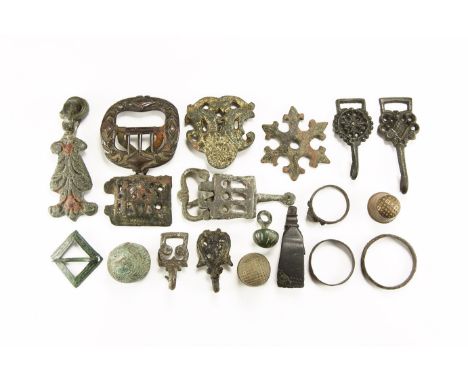 14th-18th century AD. A mixed group comprising: a beehive thimble; two tapering thimbles; four hooked clothes fasteners; a lo