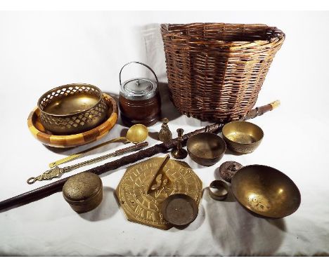 A mixed lot to include brass ware, a carved walking stick, a vintage bicycle pannier and other