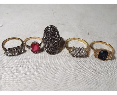 Two 9ct gold and silver dress rings, stone set, a silver ring set with marcasite and two further dress rings