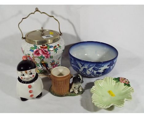 A mixed lot to include a Goebel Hummel lidded cruet pot in the form of a Pierrot, Hornsea, Sylvac, lidded biscuit barrel and 