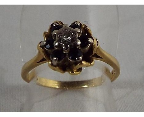 A lady's 18ct yellow gold cluster ring set with sapphire and diamond, size L, approximate weight 3.25 grams - Est £80 - £120