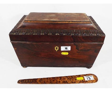 A 19th century sarcophagus oak tea caddy on bun feet, 19cm x 32cm x 18cm and an engraved wooden page turner marked 1895, 30cm