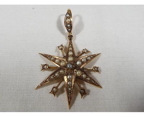 A 9ct gold star shaped pendant set with pearl, approx weight 2.2 grams