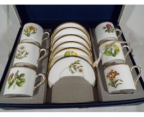 A Royal Worcester set of six coffee cans and saucers decorated in the Columbine pattern, boxed - Est £30 - £50
