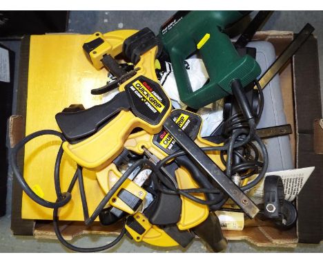 A collection of predominately modern tools to include four Quick-grip bar clamps, a Bosch hot gun model No. PHG530-2, a dreme